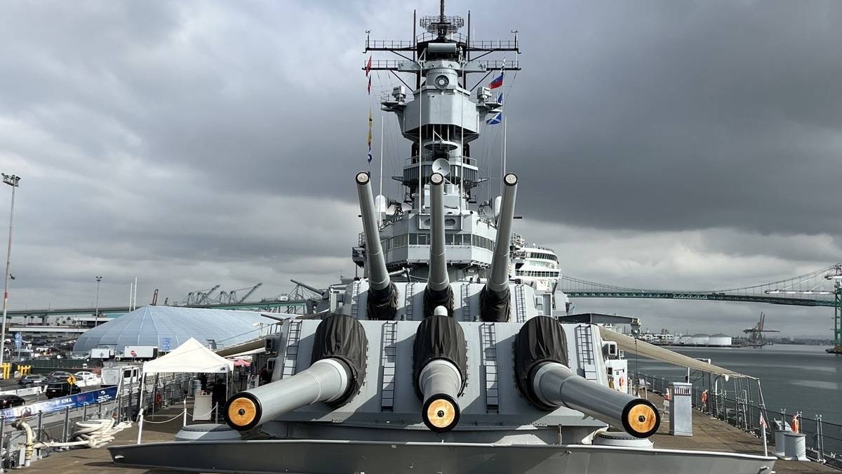 Exterior view of guns on the top of the ship under grey clouds